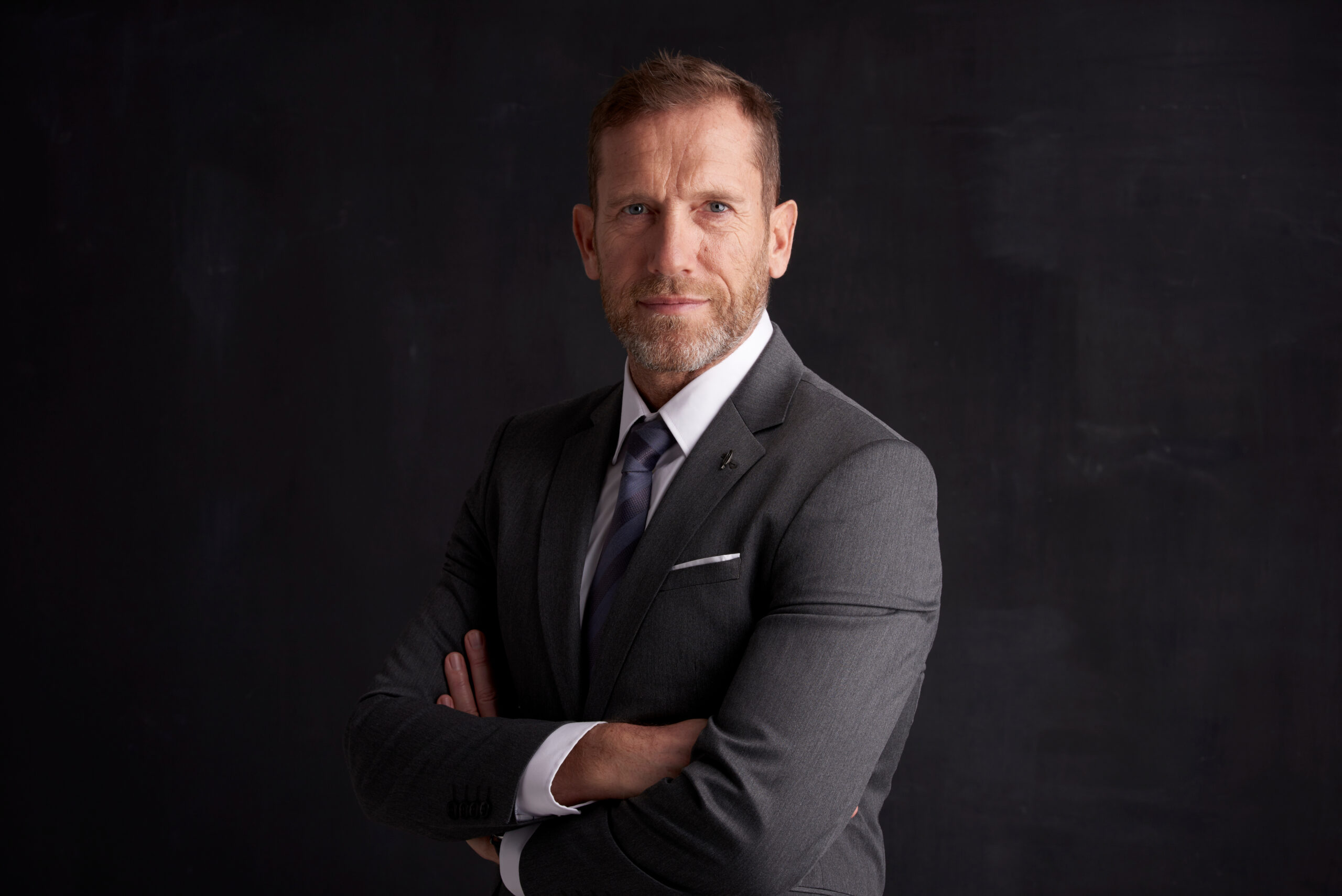 Portrait,Shot,Of,A,Middle,Aged,Businessman,Wearing,Suit,While